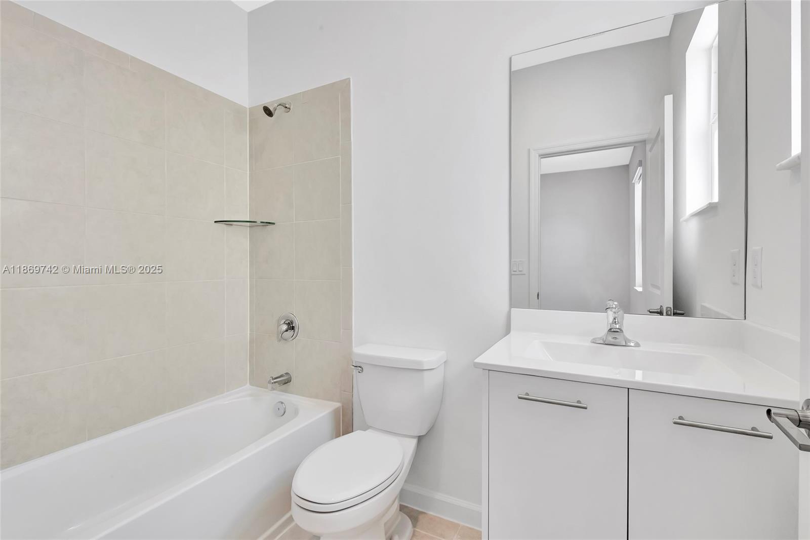 12206 Northwest 23rd Avenue Miami, FL 33167 - Photo 16 of 25 a bathroom with a sink a toilet and shower