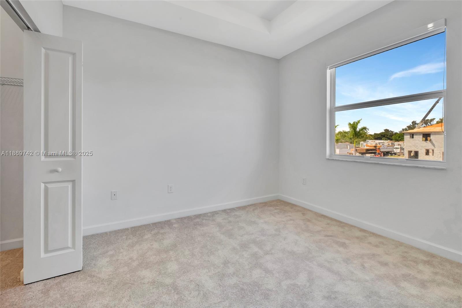 12206 Northwest 23rd Avenue Miami, FL 33167 - Photo 17 of 25 an empty room with windows