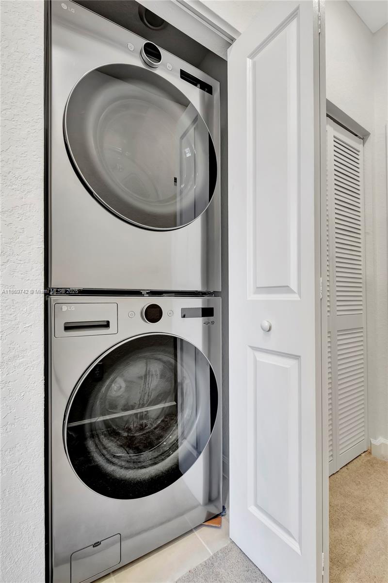 12206 Northwest 23rd Avenue Miami, FL 33167 - Photo 22 of 25 a utility room with a washer and dryer