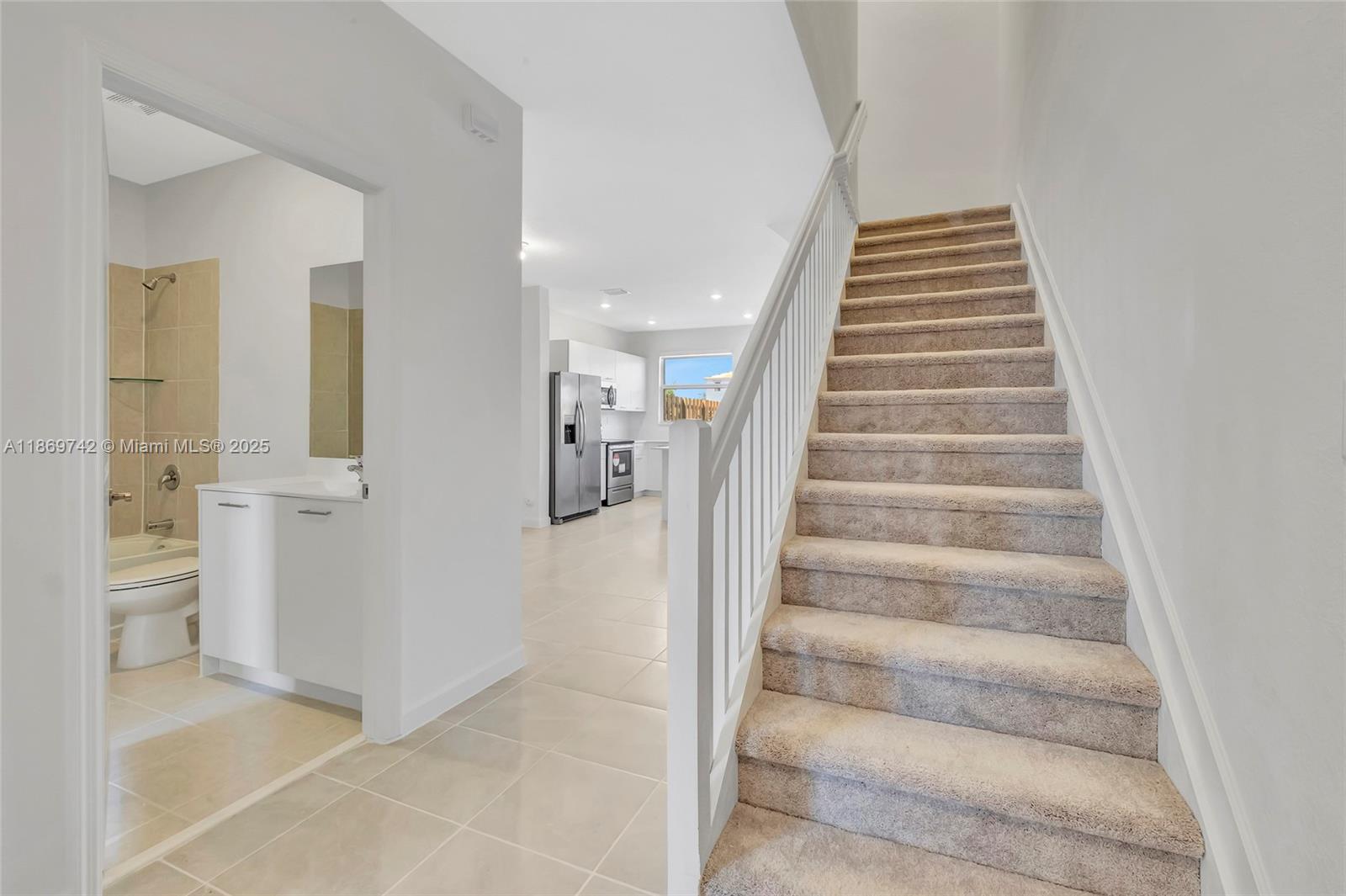 12206 Northwest 23rd Avenue Miami, FL 33167 - Photo 3 of 25 a view of an entryway with staircase