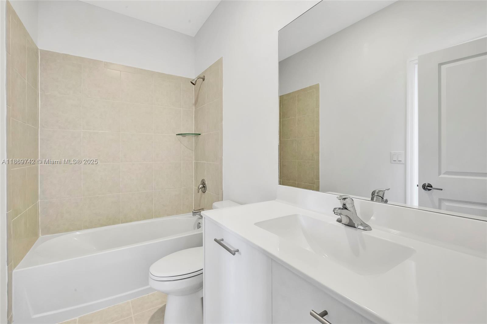 12206 Northwest 23rd Avenue Miami, FL 33167 - Photo 10 of 25 a bathroom with a sink a toilet and shower