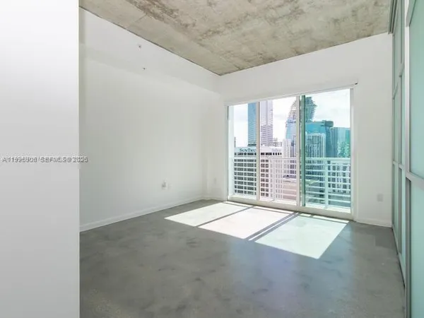 a view of a room with a large window