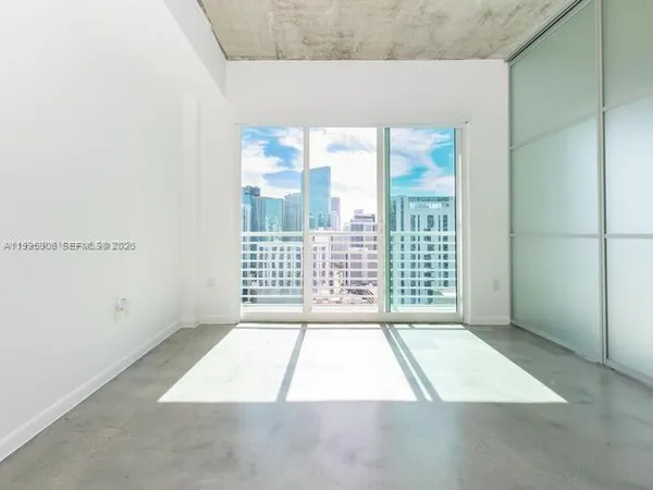 an empty room with windows