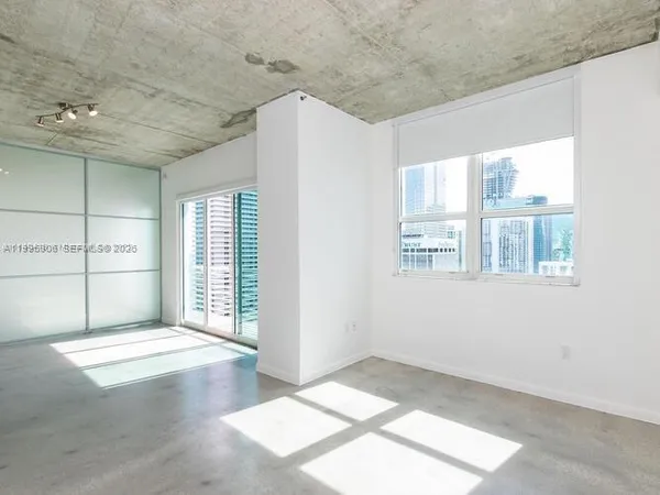 a view of an empty room with a window