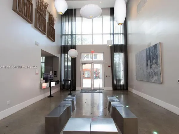 a living room with furniture and window