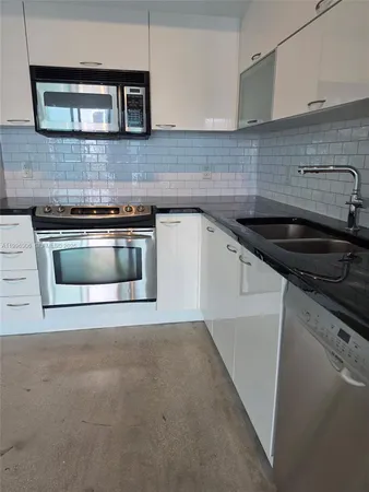 a kitchen with a stove and a microwave