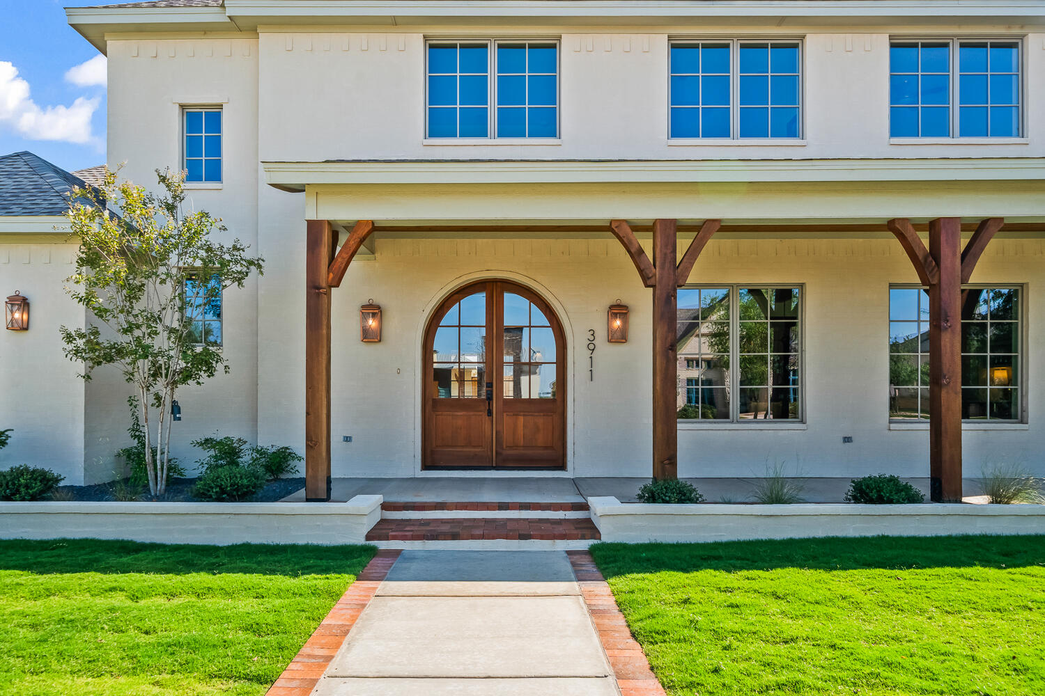 3911 149th Street Lubbock, TX 79423 - Photo 4 of 79 a front view of a house with garden