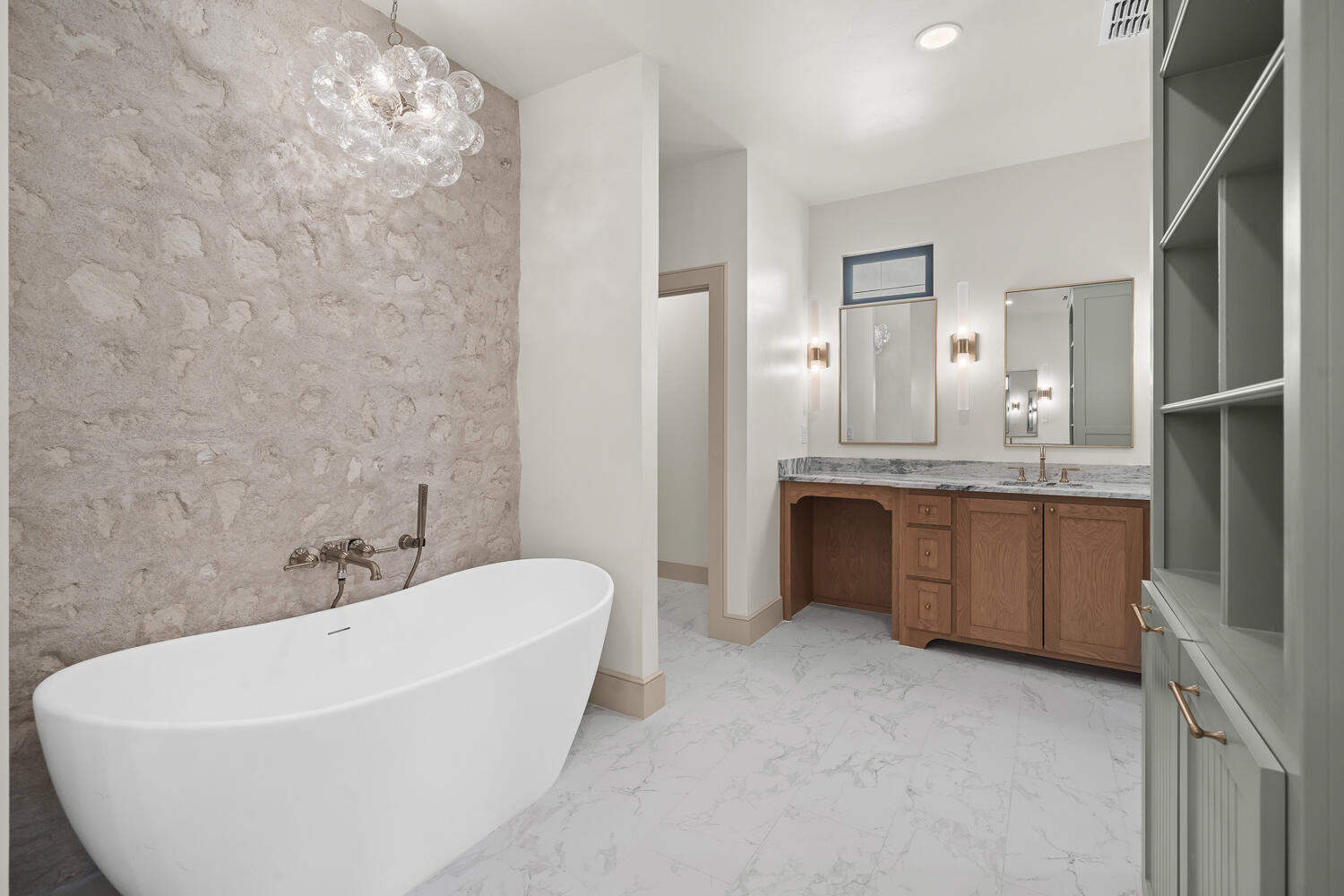 3911 149th Street Lubbock, TX 79423 - Photo 41 of 79 a bathroom with a bathtub a sink a vanity and a large mirror