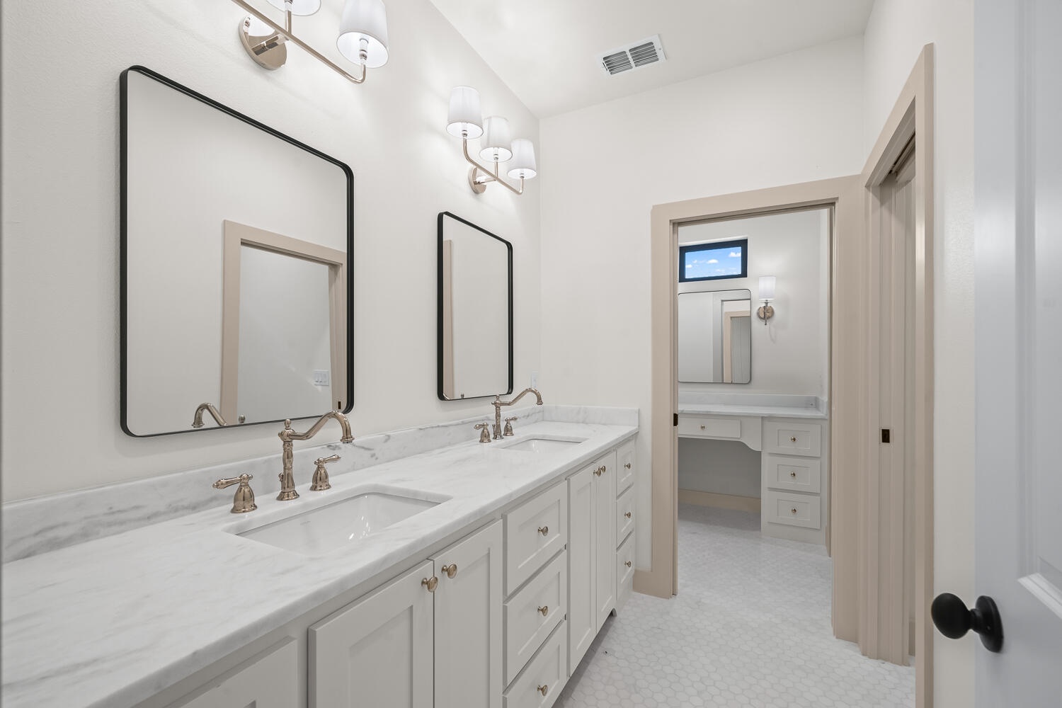 3911 149th Street Lubbock, TX 79423 - Photo 65 of 79 a bathroom with double vanity sinks and a mirror
