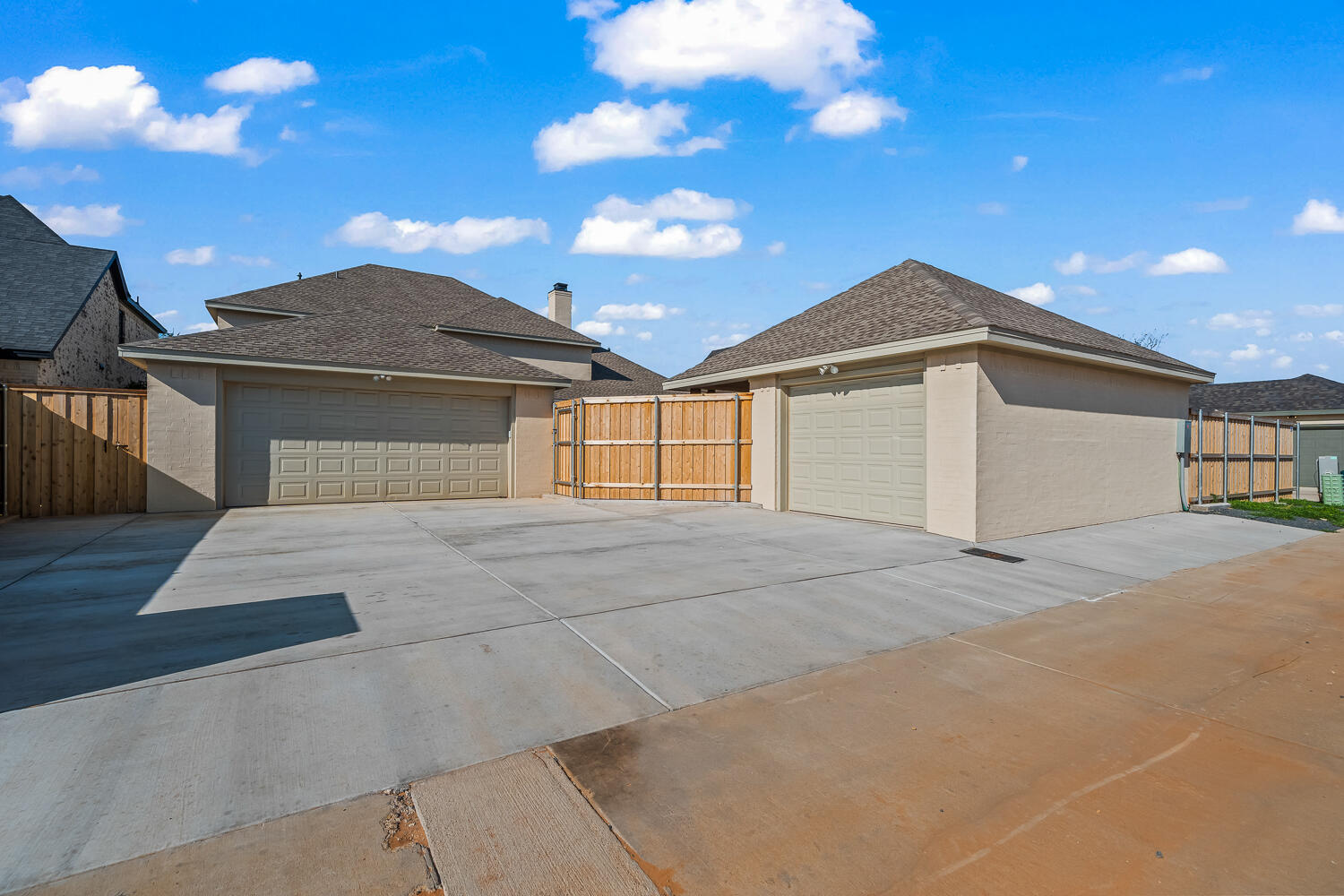 3911 149th Street Lubbock, TX 79423 - Photo 77 of 79 a front view of a house with a yard and garage