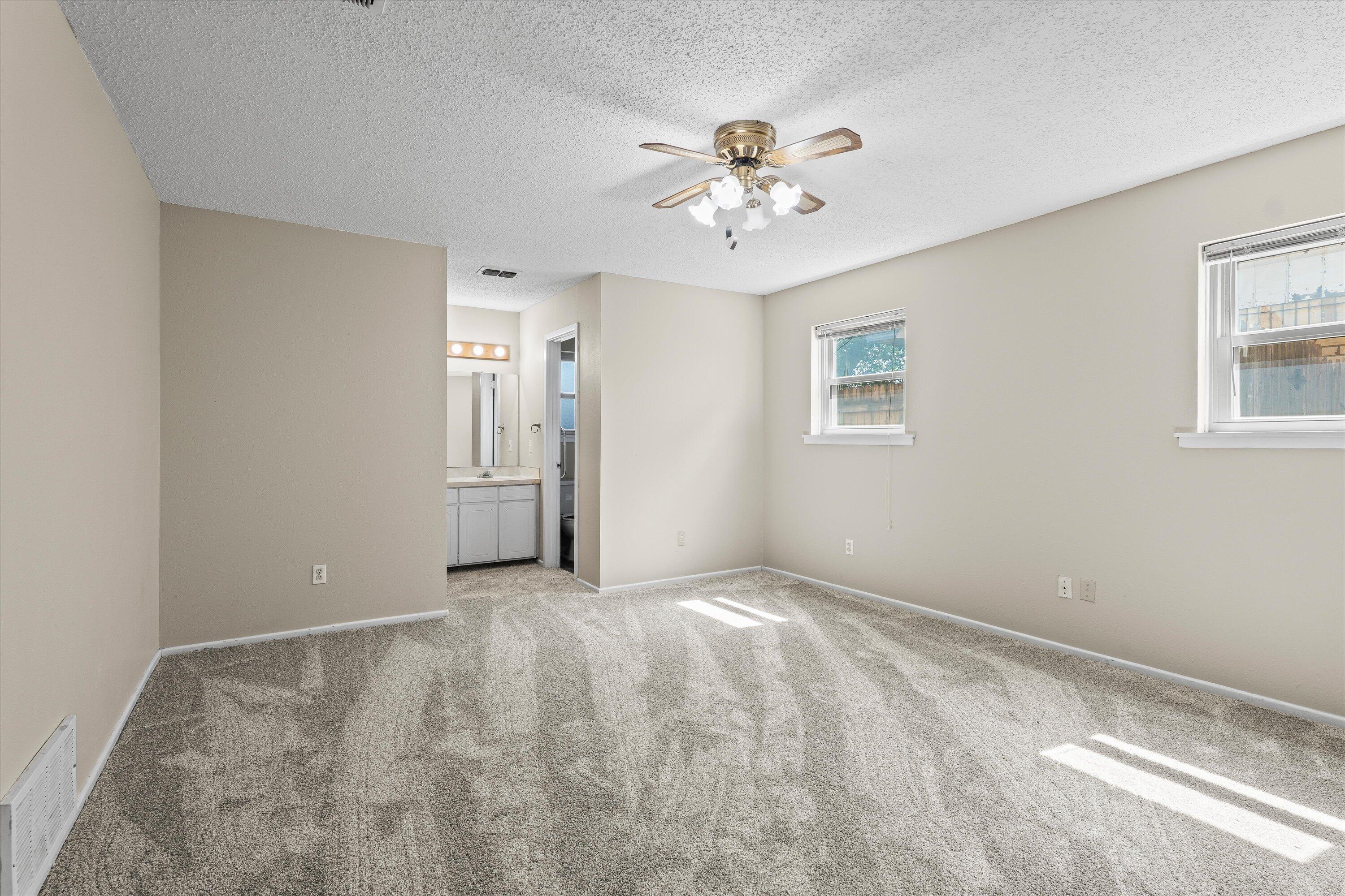4520 54th Street Lubbock, TX 79414 - Photo 14 of 32 a view of an empty room with a window
