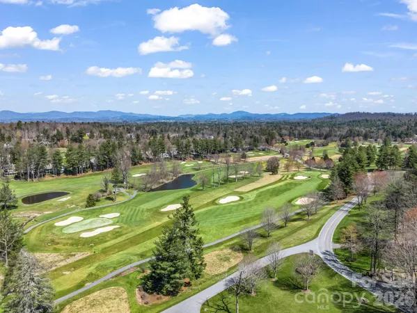 a view of a hallway with a window