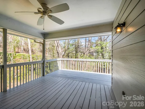 a view of a balcony with a tree