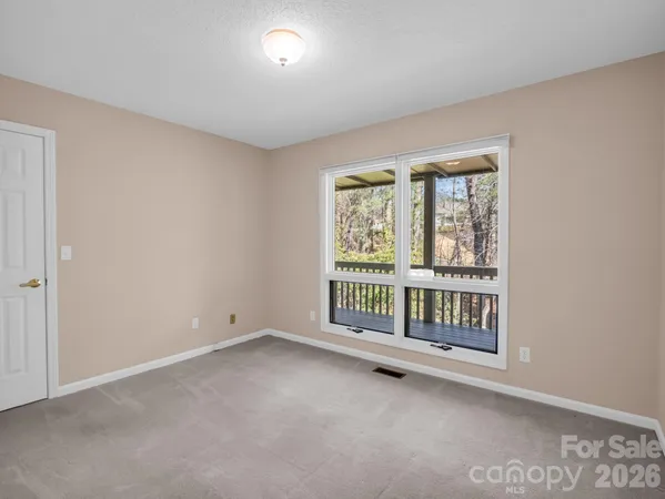 a bathroom with a sink vanity mirror and toilet