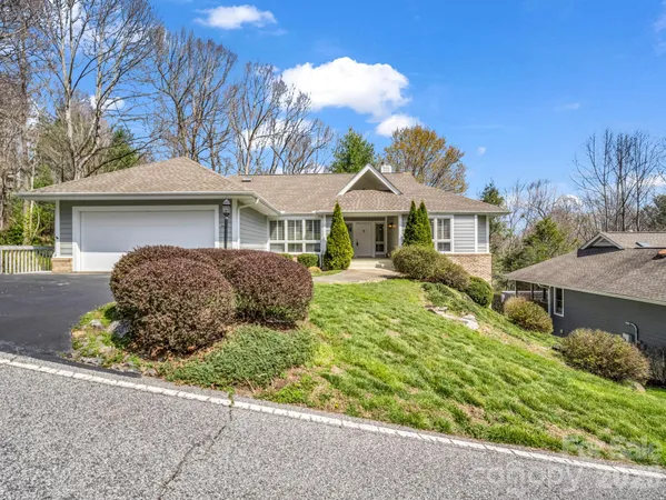 an aerial view of a house with a garden