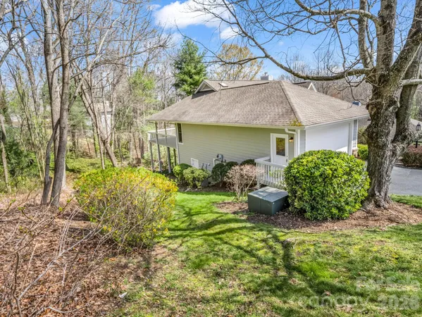 a view of a city with lush green forest