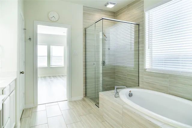 a white toilet sitting next to a white wall