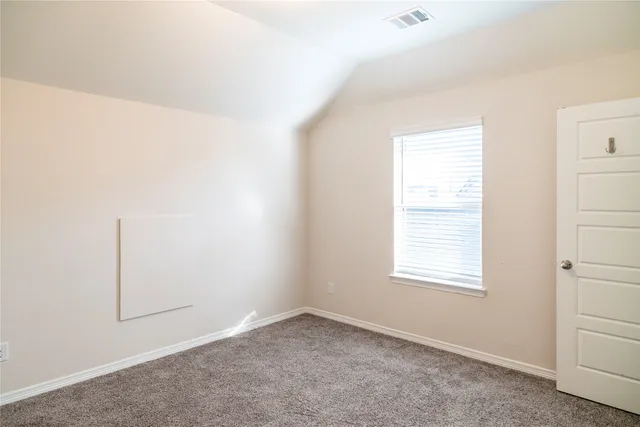 a white toilet sitting next to a bath tub