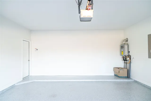 a view of a room with wooden floor and a bathroom