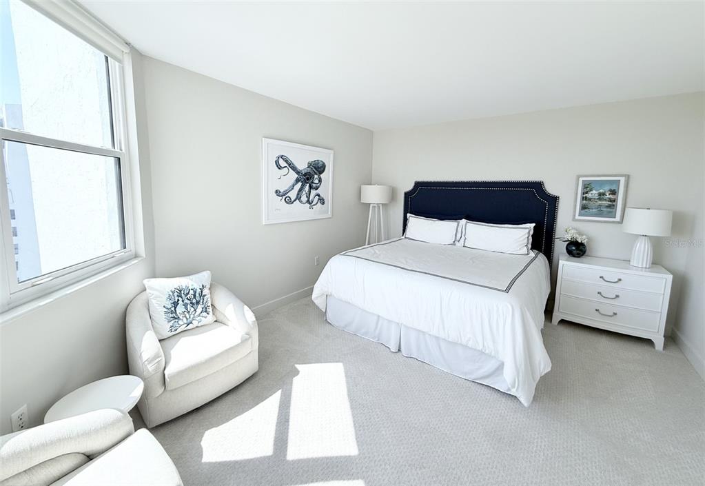 1050 Longboat Club Road, Unit 803 Longboat Key, FL 34228 - Photo 25 of 39 a bedroom with a bed and a couch