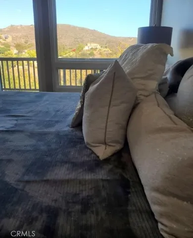 a view of balcony with furniture