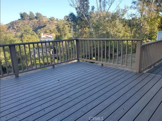 a view of wooden deck with a yard