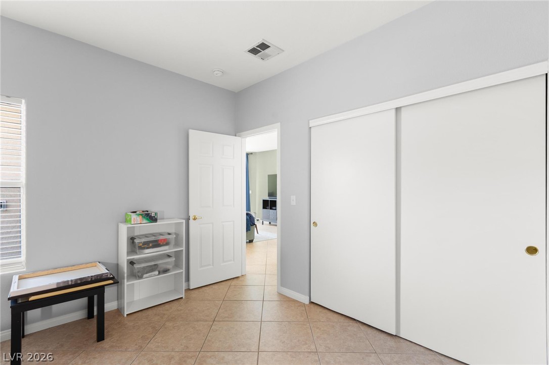 3238 Mystic Ridge Court Las Vegas, NV 89129 - Photo 15 of 31 Functional room with versatile tile flooring and ample storage from two large closets.