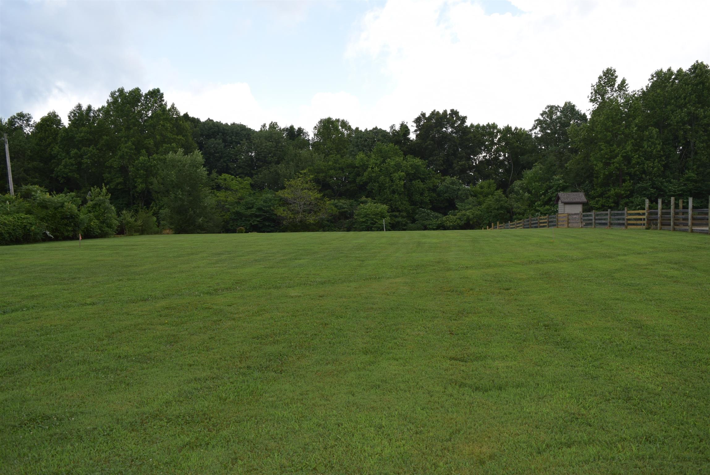 0 Lyndell Bell Road Manchester, TN 37355 - Photo 2 of 7 a view of a field with trees in the background