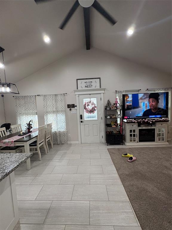 1610 Ridgeview Circle Granbury, TX 76048 - Photo 12 of 13 a living room with lots of furniture and clutter