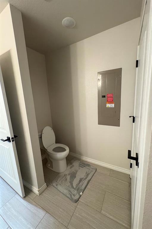 1610 Ridgeview Circle Granbury, TX 76048 - Photo 8 of 13 a bathroom with a toilet and a shower