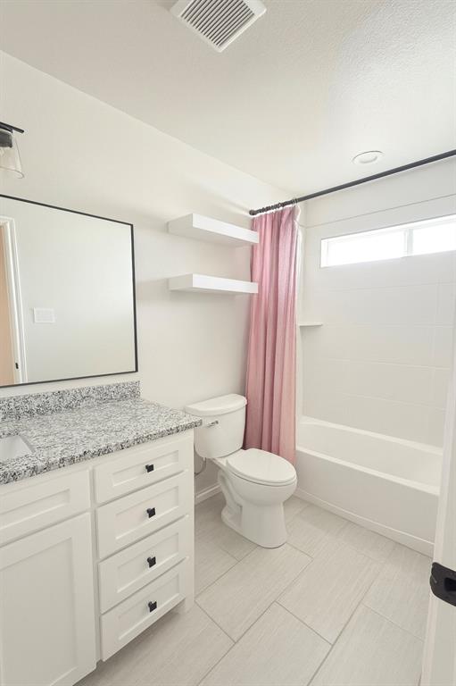 1610 Ridgeview Circle Granbury, TX 76048 - Photo 9 of 13 a bathroom with a granite countertop sink toilet and shower