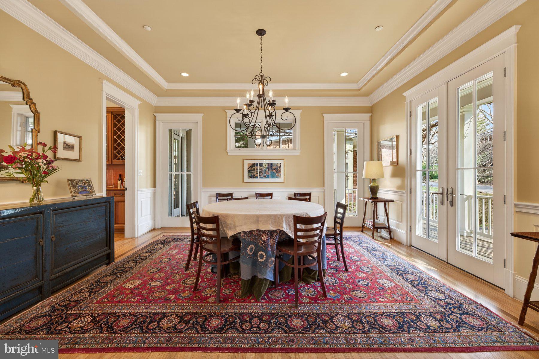 6115 Madawaska Road Bethesda, MD 20816 - Photo 11 of 78 a view of a dining room with furniture window and wooden floor