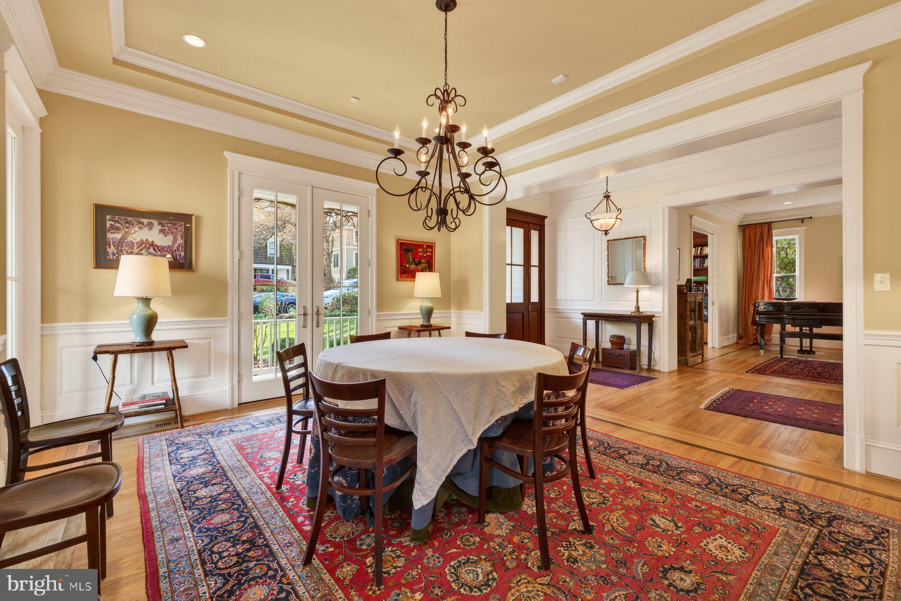 6115 Madawaska Road Bethesda, MD 20816 - Photo 12 of 78 a view of a dining room with furniture window and wooden floor