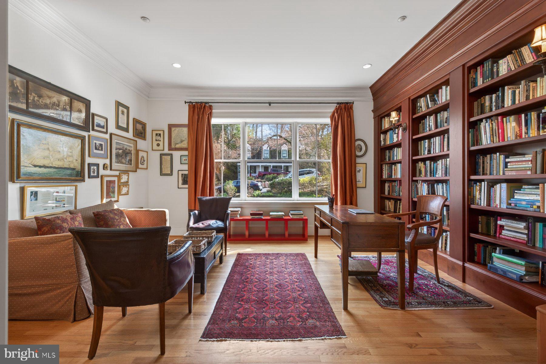 6115 Madawaska Road Bethesda, MD 20816 - Photo 13 of 78 a living room with furniture and a book shelf
