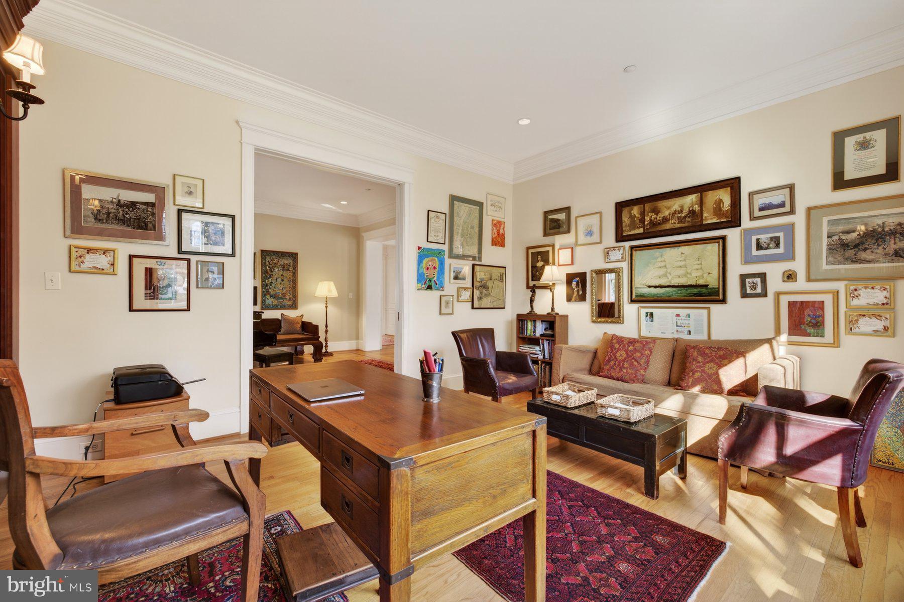 6115 Madawaska Road Bethesda, MD 20816 - Photo 14 of 78 a living room with fireplace furniture and two windows