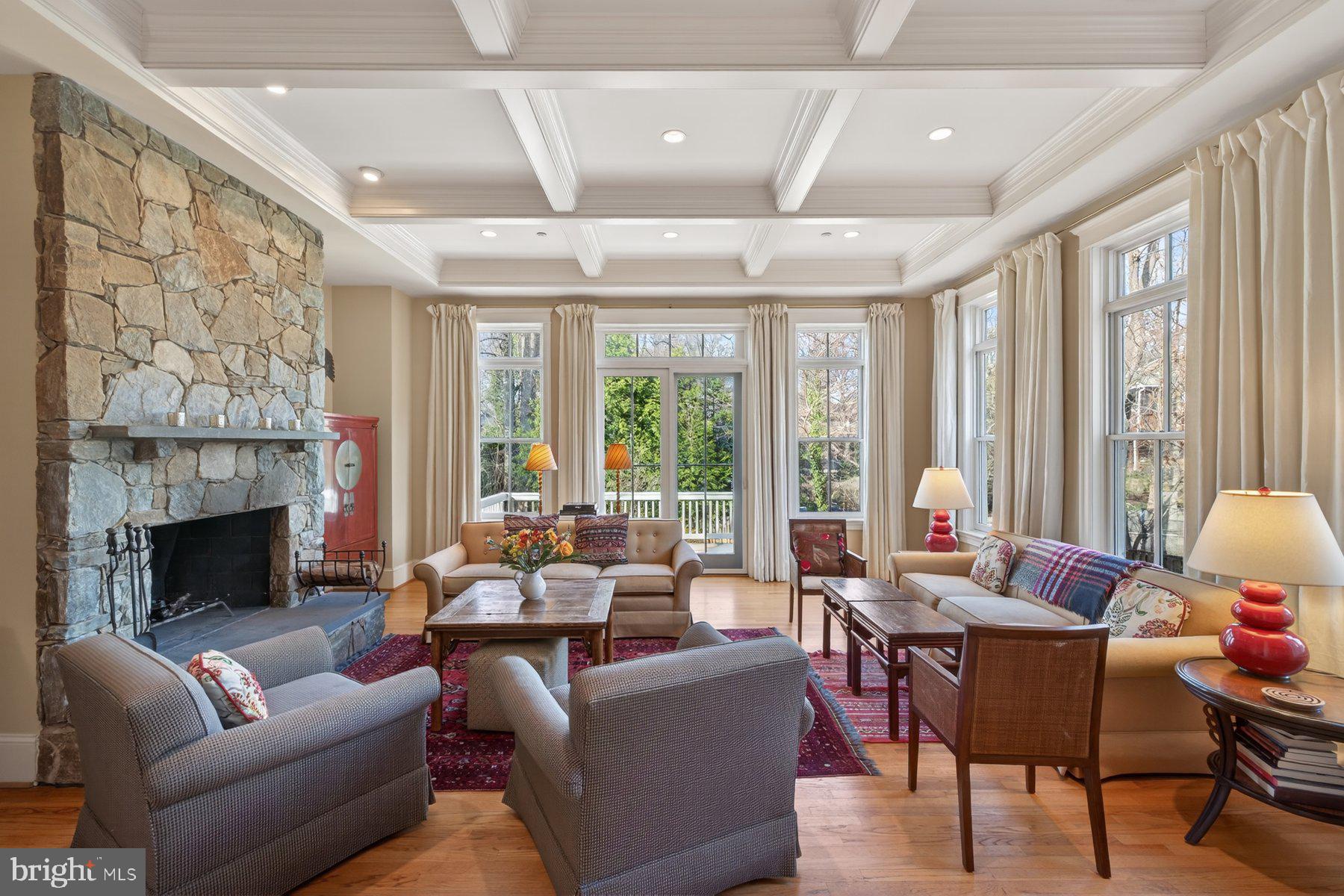 6115 Madawaska Road Bethesda, MD 20816 - Photo 27 of 78 a living room with furniture and a fireplace