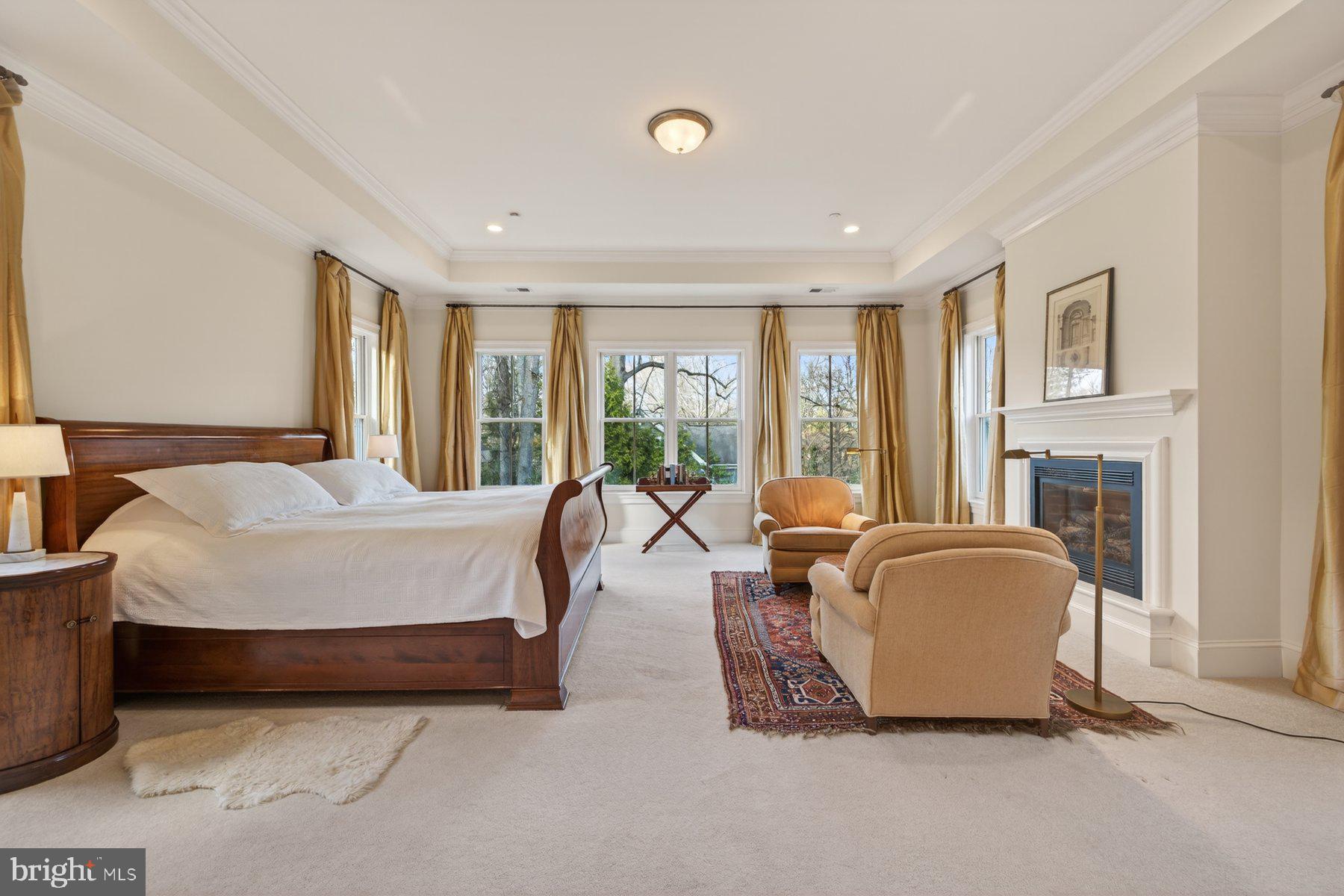 6115 Madawaska Road Bethesda, MD 20816 - Photo 30 of 78 a spacious bedroom with a bed and large windows