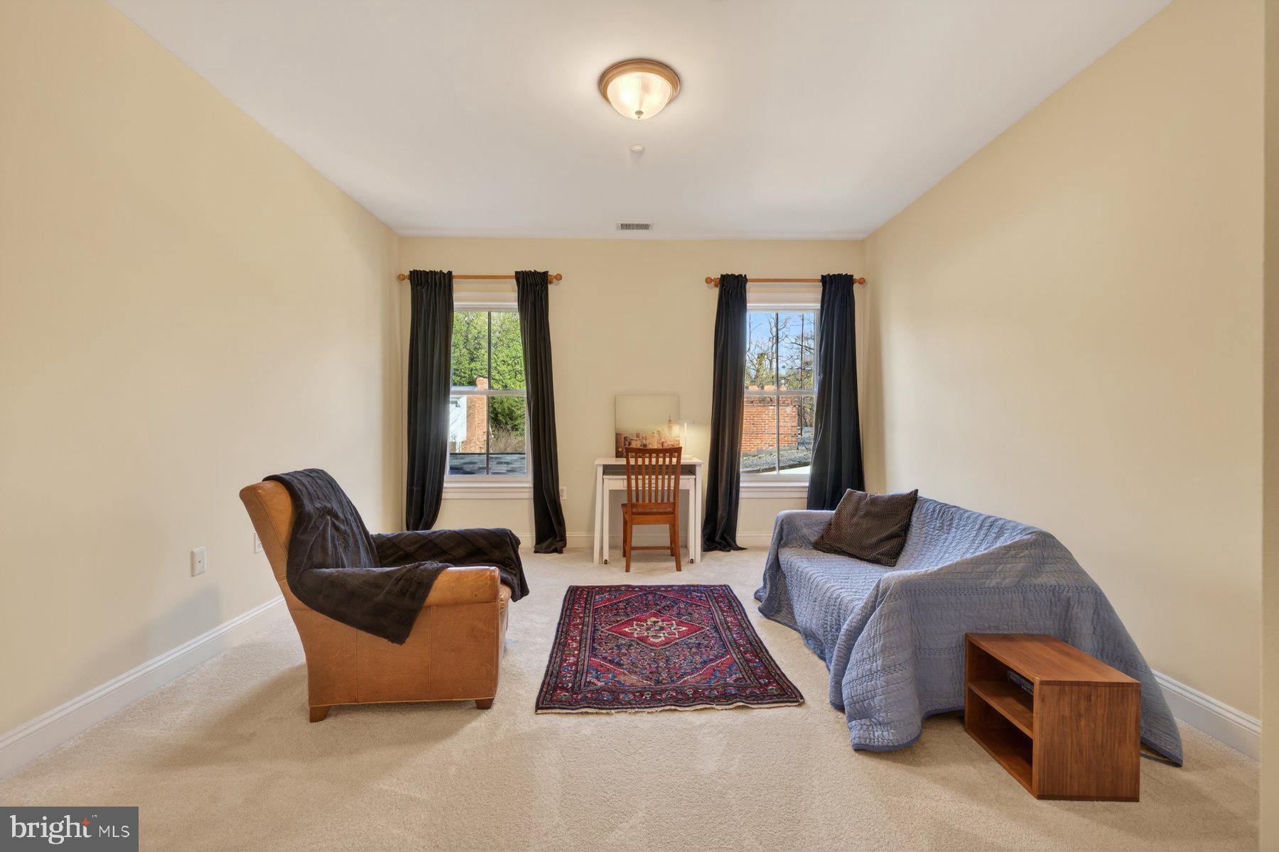 6115 Madawaska Road Bethesda, MD 20816 - Photo 39 of 78 a living room with furniture and a large window