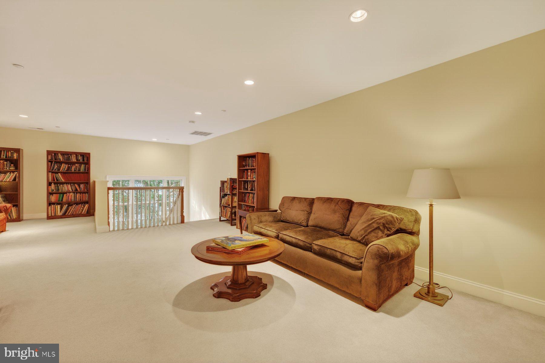 6115 Madawaska Road Bethesda, MD 20816 - Photo 51 of 78 a living room with furniture and a table