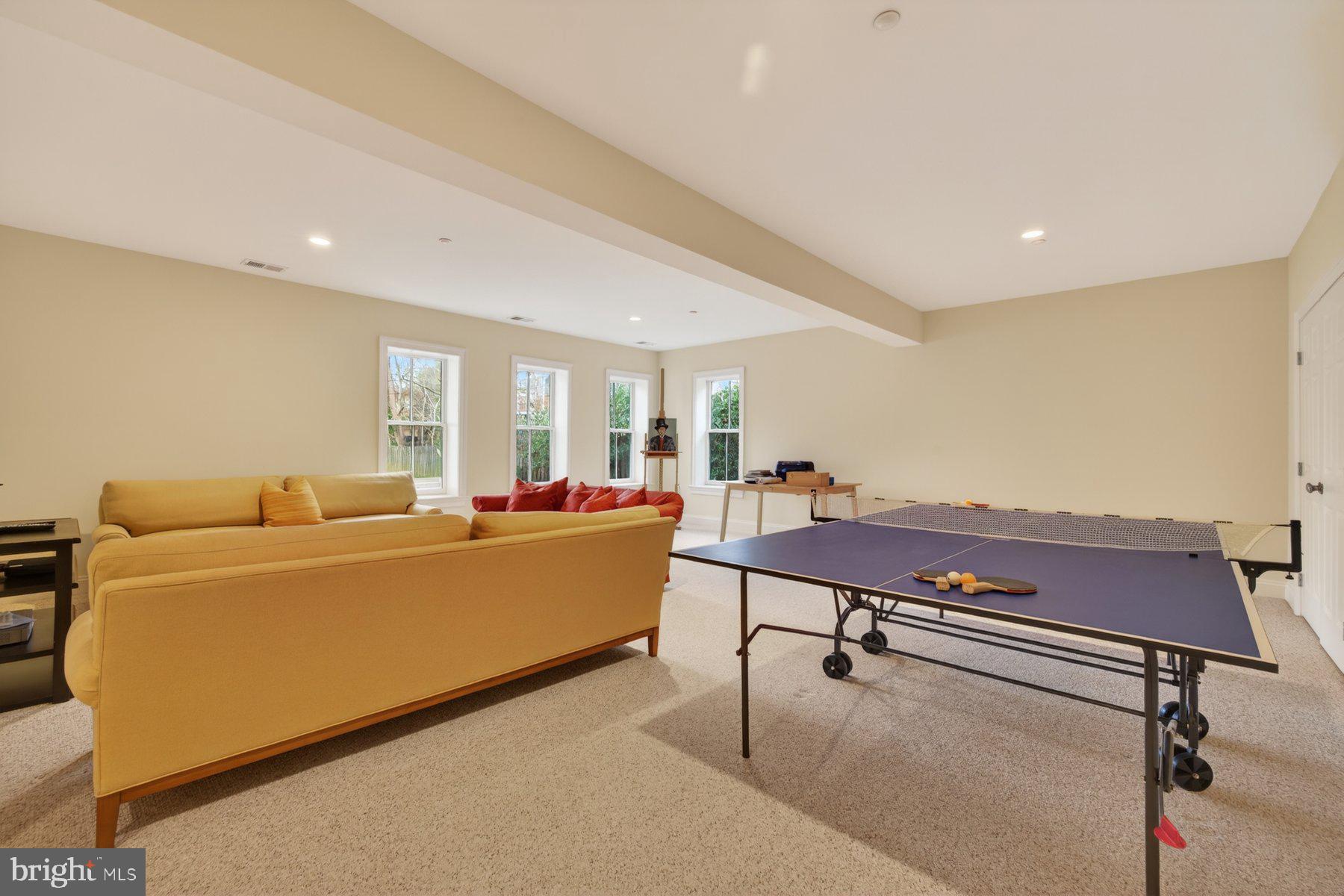 6115 Madawaska Road Bethesda, MD 20816 - Photo 56 of 78 a living room with furniture pool table and a window