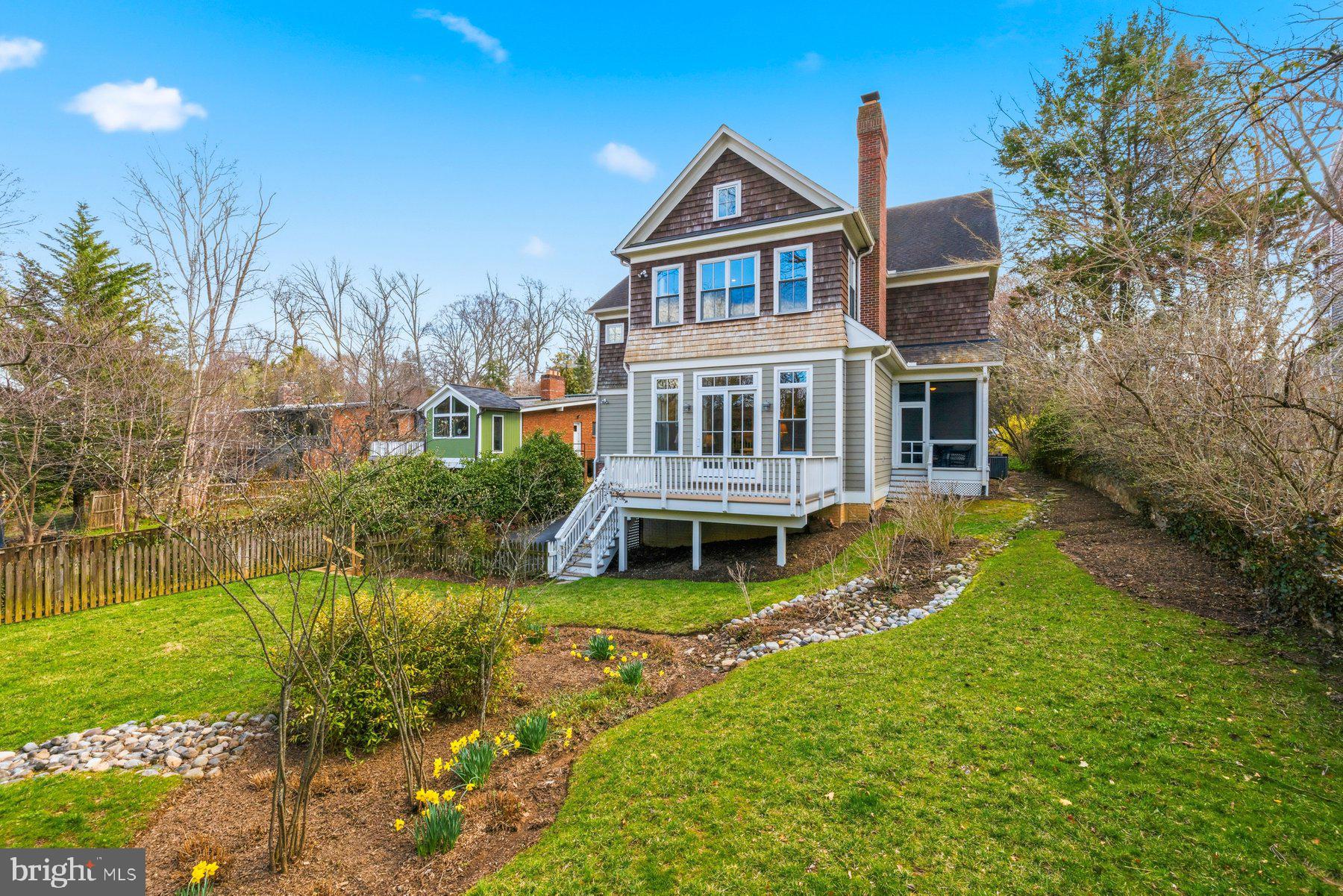 6115 Madawaska Road Bethesda, MD 20816 - Photo 71 of 78 front view of a house with a yard table and chairs