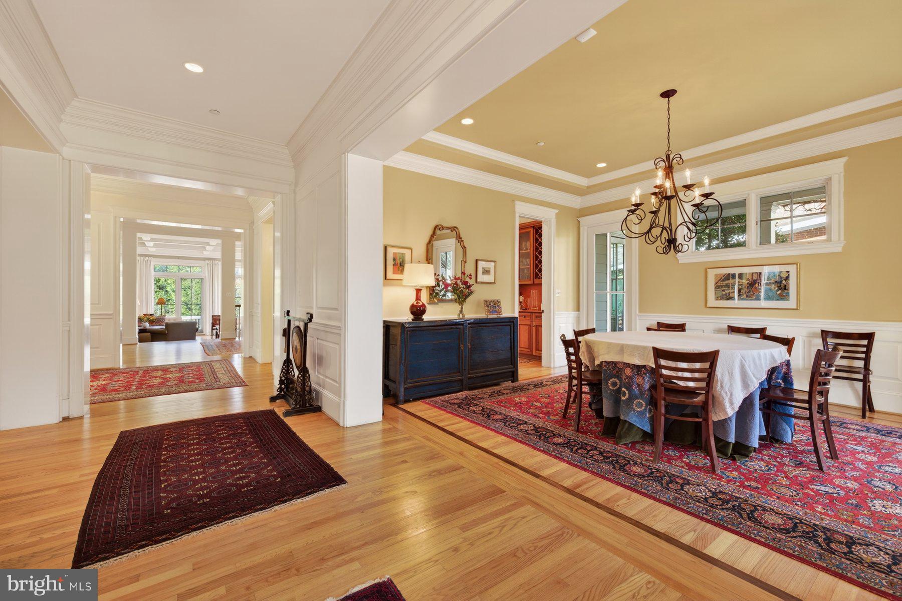 6115 Madawaska Road Bethesda, MD 20816 - Photo 10 of 78 a living room with furniture and a chandelier