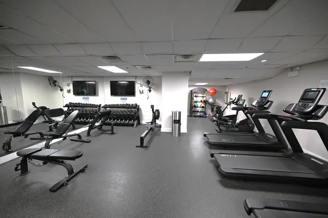a view of a living room and kitchen