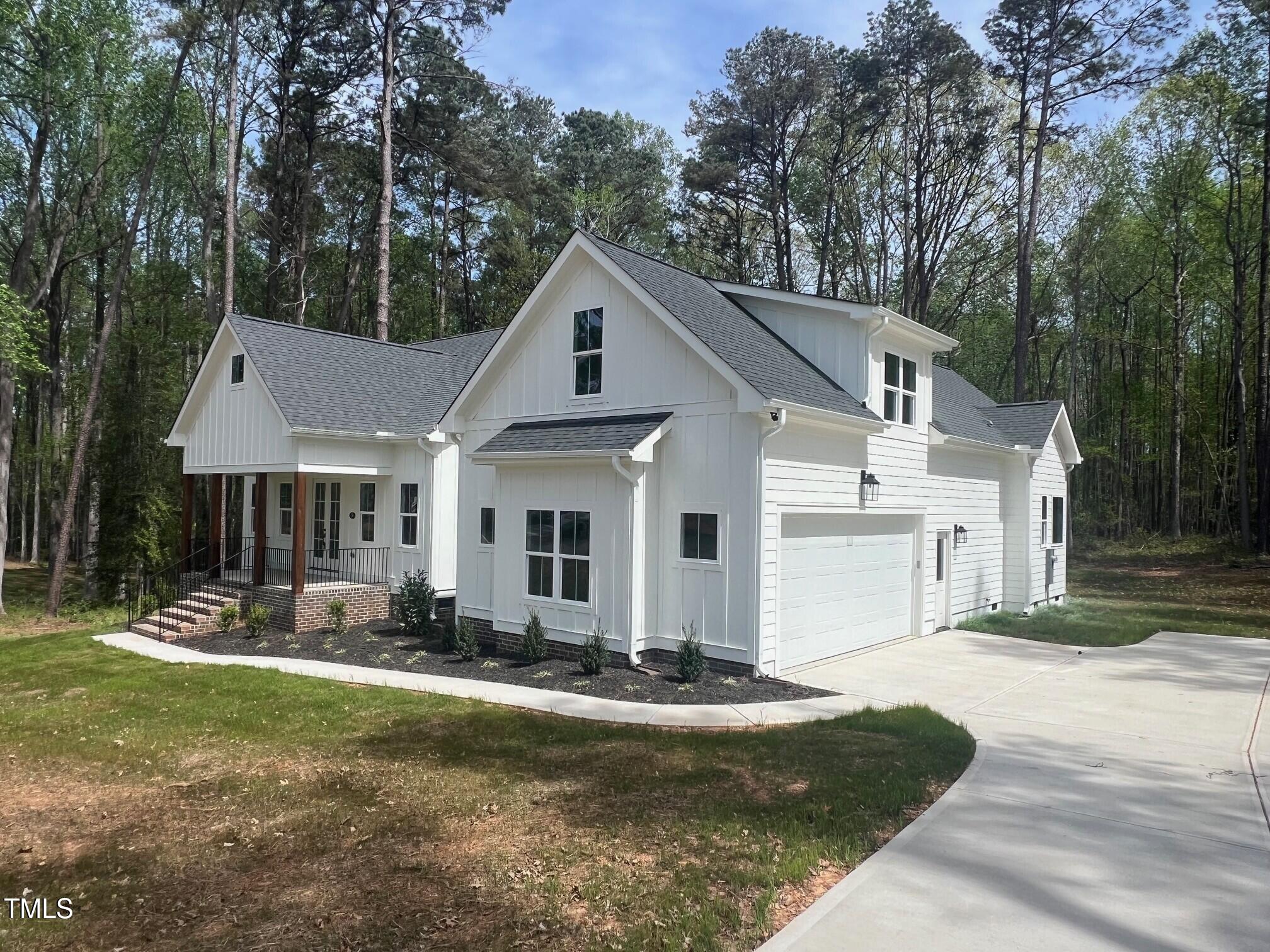 30 Tamaran Ct Spring Spring Hope, NC 27882 - Photo 2 of 37 a front view of a house with garden