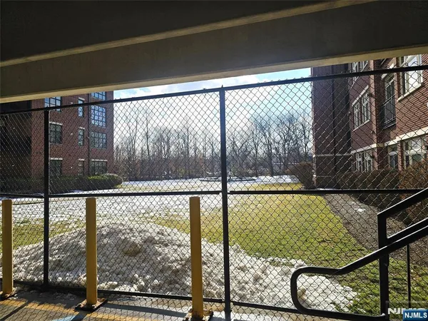 a view of a balcony with wooden floor