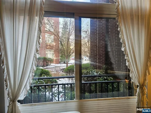 a view of a balcony and floor to ceiling window