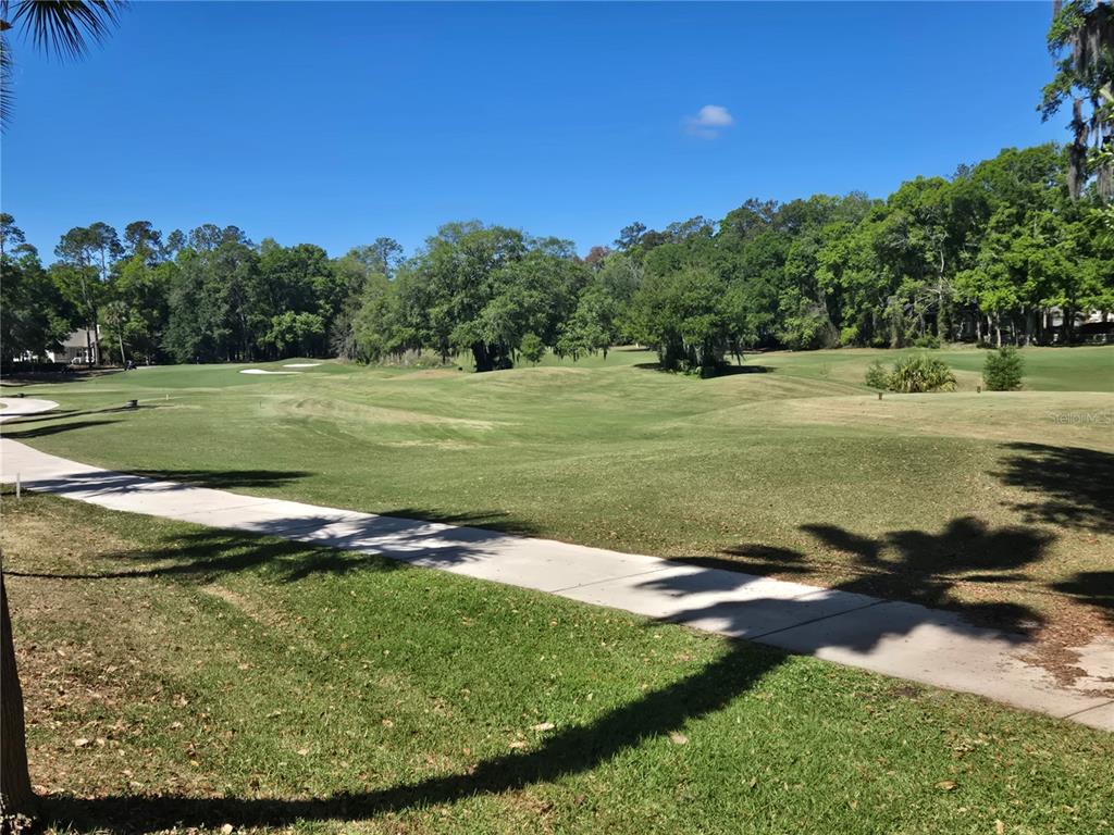 9123 Southwest 47 Place Gainesville, FL 32608 - Photo 3 of 3 a view of a golf course with a lake