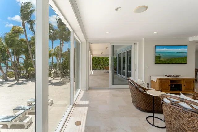 a view of dining room with furniture and floor to ceiling window