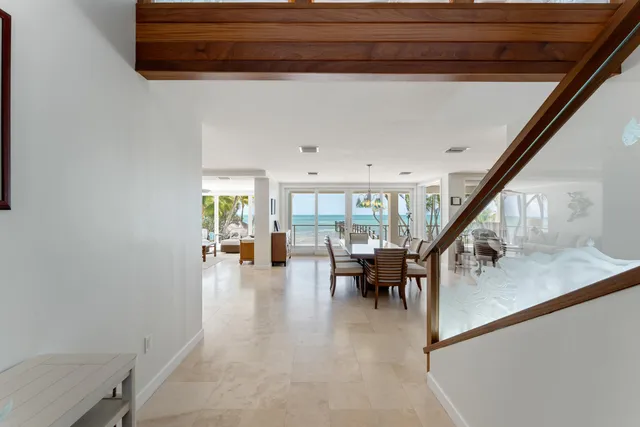 a view of a hallway with potted plants