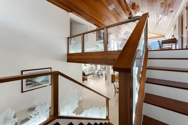 a view of a dining room with furniture and a flat screen tv
